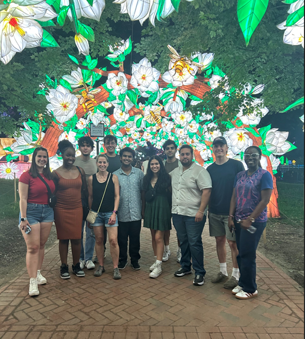 Group photo in front of lighted lanterns