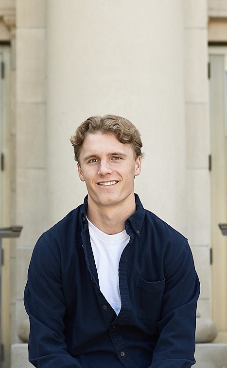 a man outside in front of a building